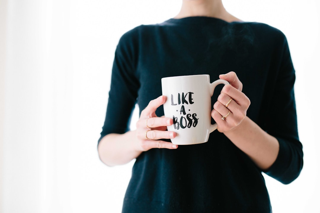 A mom holding her favorite personalized mug in a warm kitchen