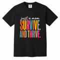 Comfort Colors black t-shirt with colorful "Just a Mom, Survive and Thrive" empowering mom life shirt design