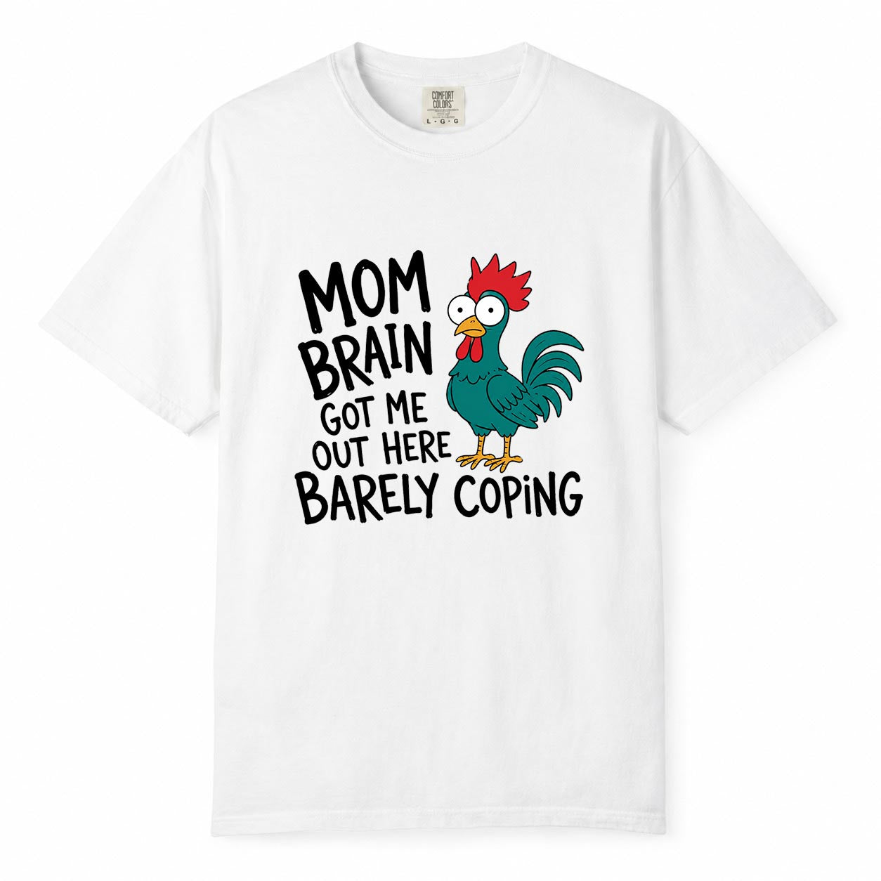 Comfort Colors white t-shirt with cartoon chicken graphic and "Mom Brain Got Me Out Here Barely Coping" funny tired mom life shirt design