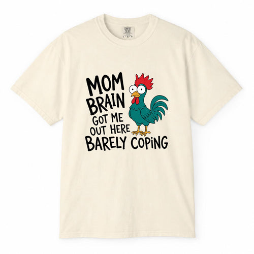 Comfort Colors ivory t-shirt with cartoon chicken graphic and "Mom Brain Got Me Out Here Barely Coping" funny tired mom life shirt design