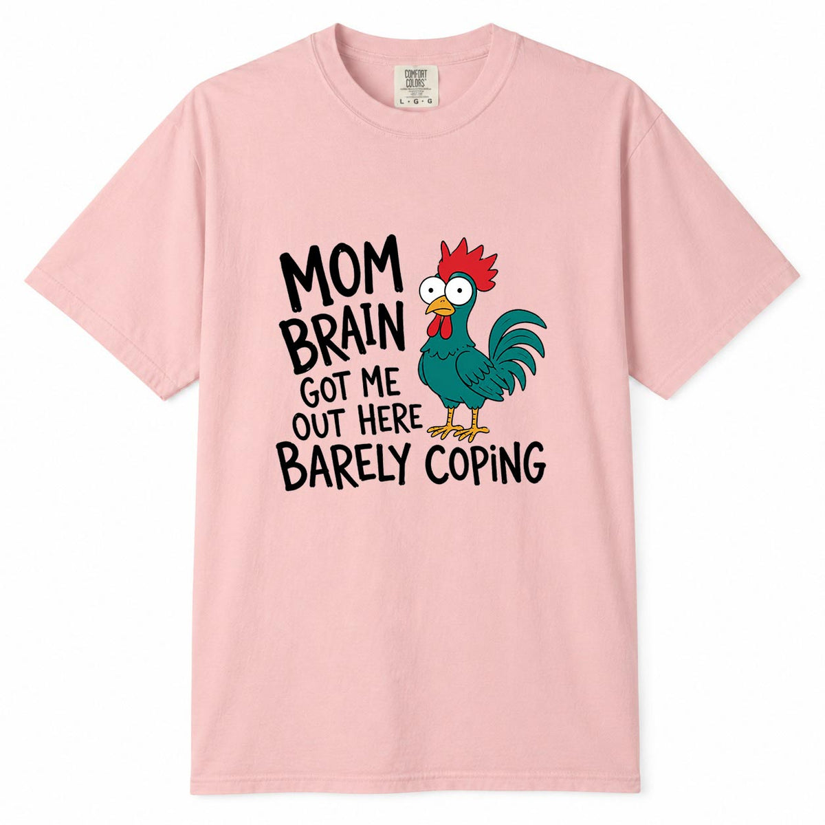 Comfort Colors blossom t-shirt with cartoon chicken graphic and "Mom Brain Got Me Out Here Barely Coping" funny tired mom life shirt design