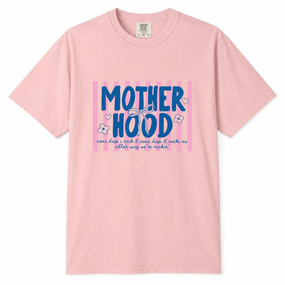 Comfort Colors blossom t-shirt with pink striped "Motherhood, some days I rock it, some days it rocks me" mom life shirt design with bow and flowers
